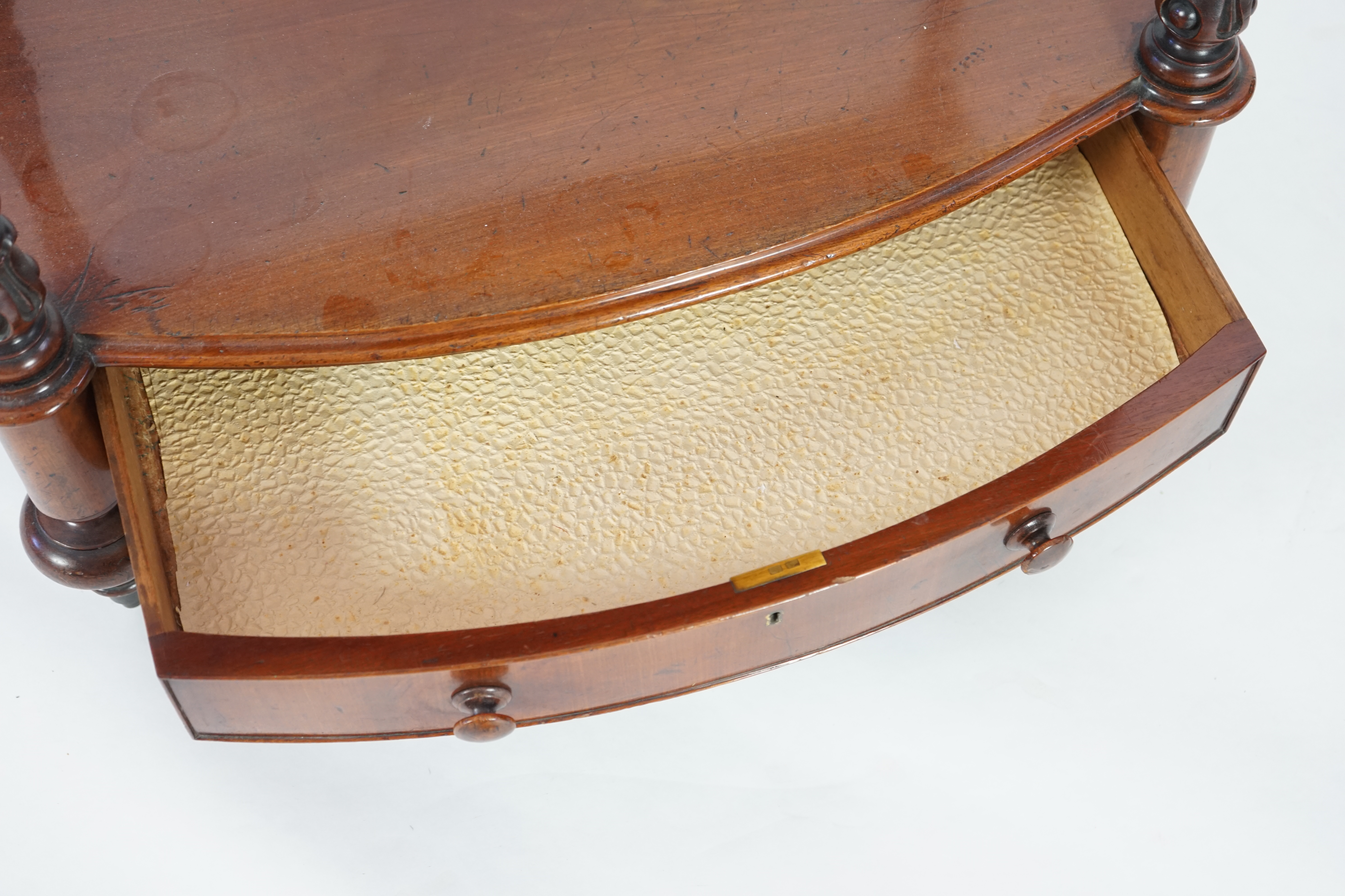 A Victorian mahogany bow fronted two tier whatnot, with fitted drawer, width 66cm, height 73cm. Condition - good